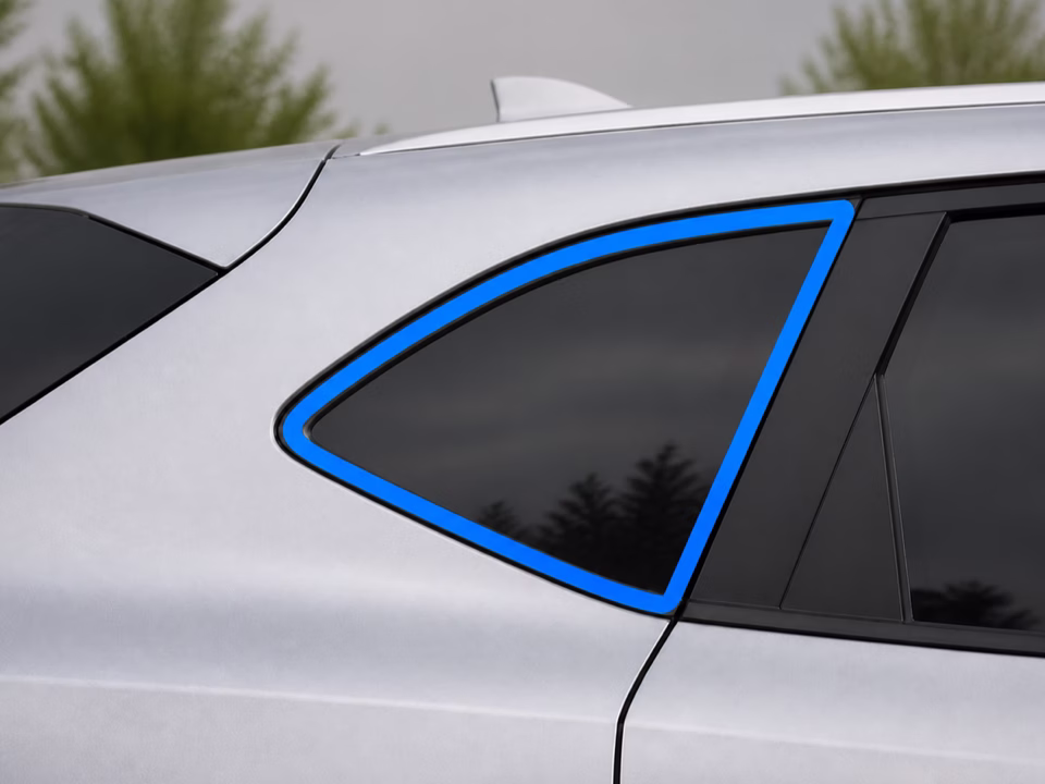 Centered side quarter glass fully outlined in bright blue on a silver crossover