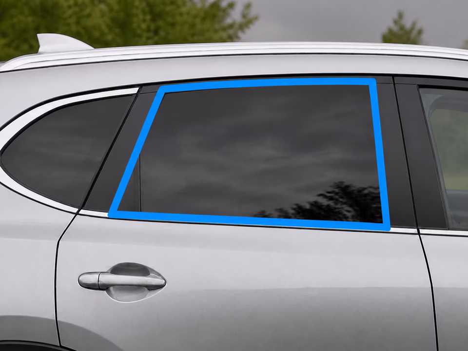 Centered rear side door glass fully outlined in bright blue on a silver crossover