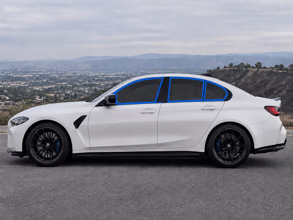 Driver-side windows outlined in blue on a white sedan